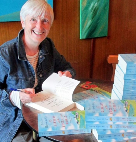 Irish author Felicity Hayes-McCoy signing her first Finfarran novel The Library at The Edge of The World at the iconic bookshop An Café Liteartha, in Dingle town on Ireland's Dingle Peninsula