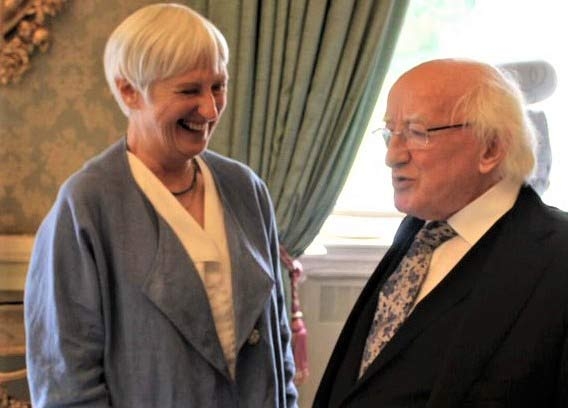 Bestselling Irish author Felicity Hayes-McCoy, laughing with President of Ireland Michael D Higgins, at the President's Residence, Áras an Uachtaráin, Dublin, Ireland.